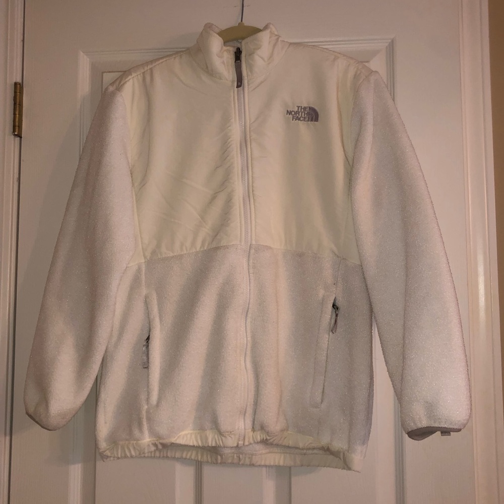 White North Face zip up jacket.